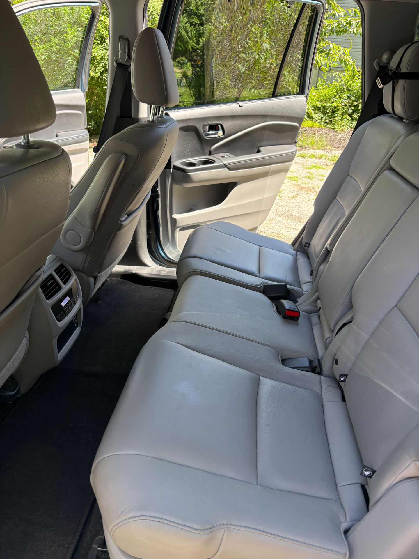 Clean gray leather backseat interior after detailing